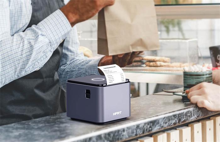 POS receipt printer printing order at coffee shop counter